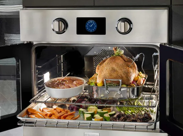 The BlueStar BSEWO30DDV3 oven featuring a variety of baked goods 