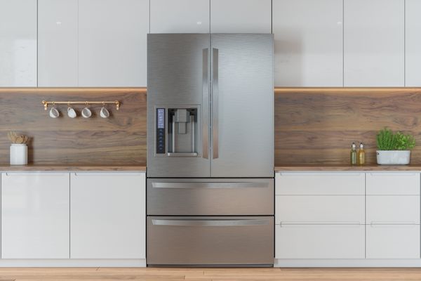 Front view of a counter depth French door fridge in a kitchen 