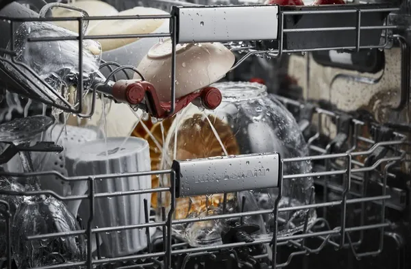 A close-up of dishes inside the KitchenAid KDTM704KPS dishwasher 