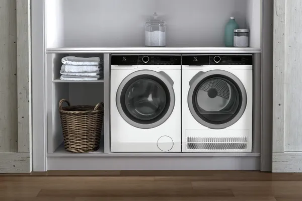 The Electrolux ELFW4222AW washer and dryer underneath a counter 