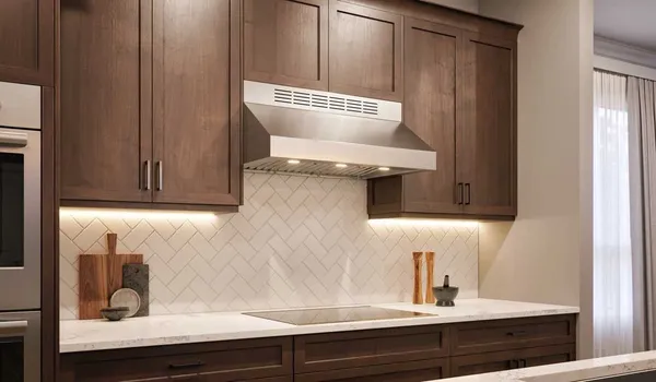 The Faber Breva Pro 11 under cabinet range hood in a kitchen 