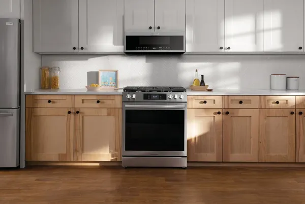 The Frigidaire Gallery GCFG3060BF slide-in range and matching microwave in a kitchen 