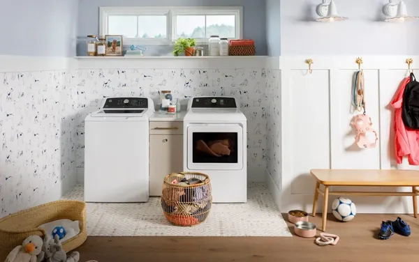 The GE GTW585BSVWS washer and GE GTD58EBSVWS dryer pair in a laundry room 