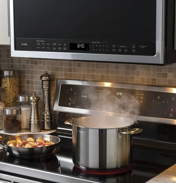 The GE Profile PVM9005SJSS microwave with overhead lighting on 