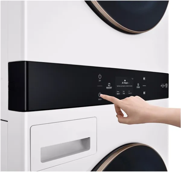 A person selecting a cycle on the LG Studio SWWE50W4 WashTower