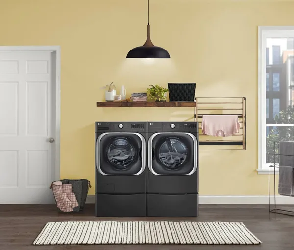 The LG WM8900HBA washer and matching dryer in a laundry room 