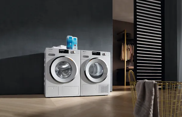 The Miele WXI 860 WCS washer and dryer set in a laundry room 