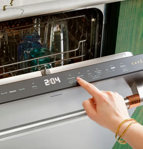 A person selecting a Cafe dishwasher mode