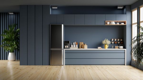 A blue single wall kitchen