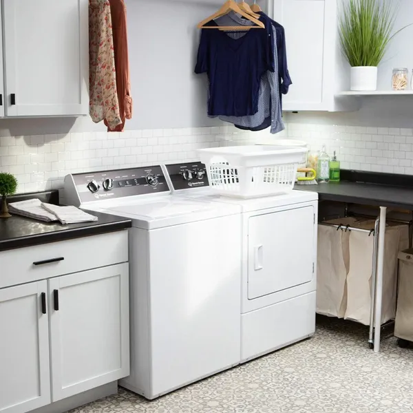 The Speed Queen TR5003WN washer and TR5003WN dryer in a laundry room 