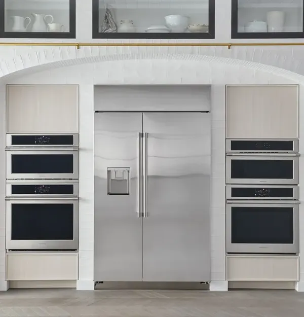 The Monogram ZISS480DNSS refrigerator in a luxury kitchen 