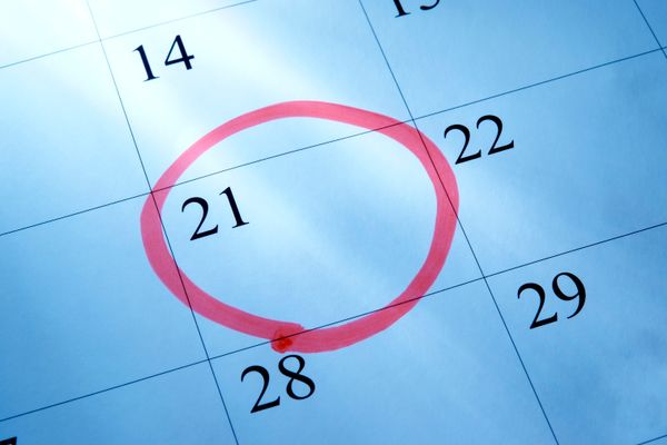 A calendar with the 21st day of a month circled in red 