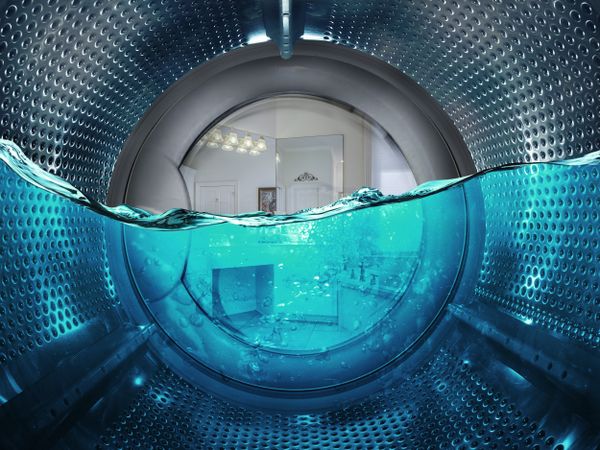 An inside view of a front load washer full of water