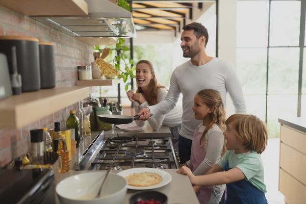 A family cooking in a kitchen 