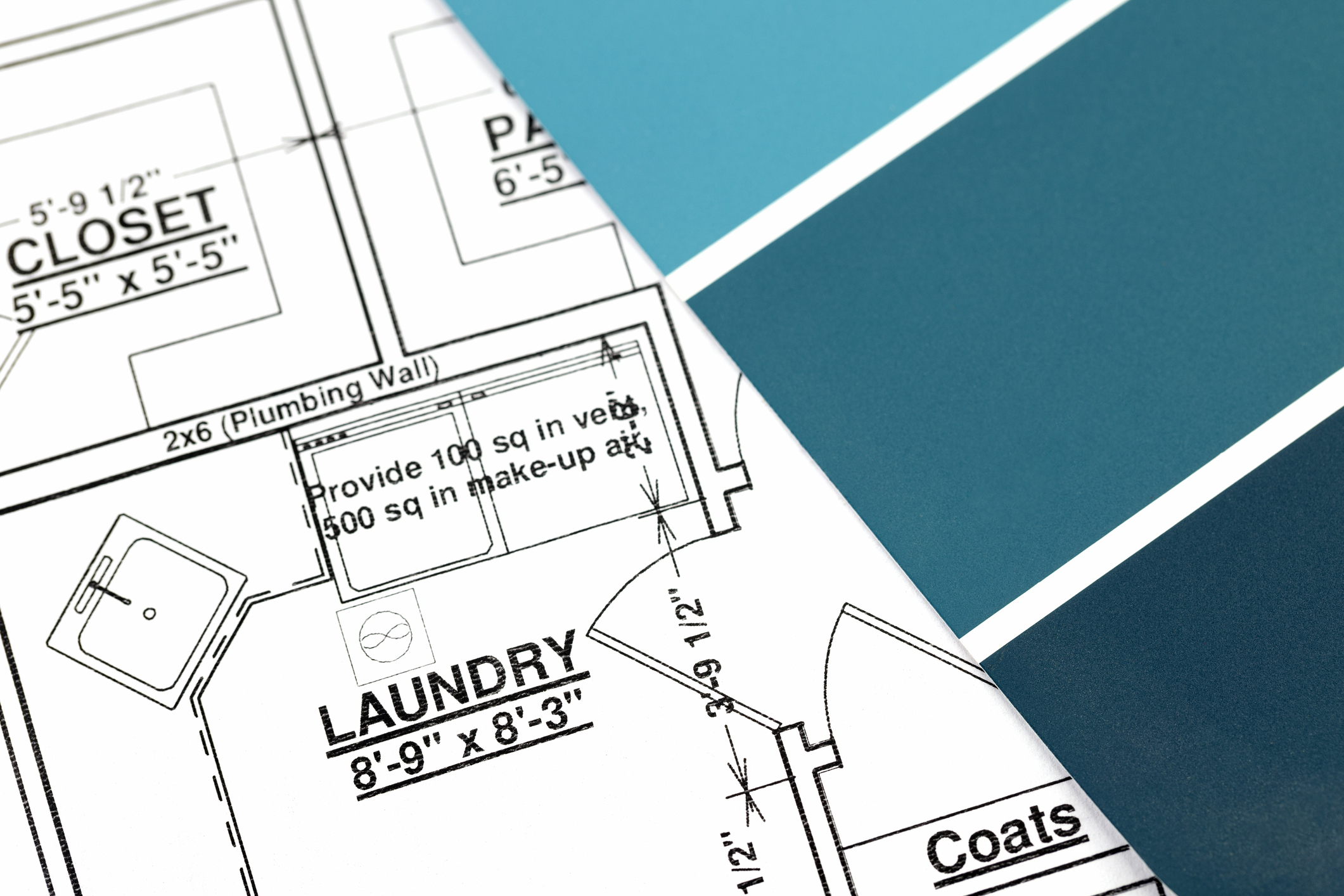 A blueprint and blue paint swatches 