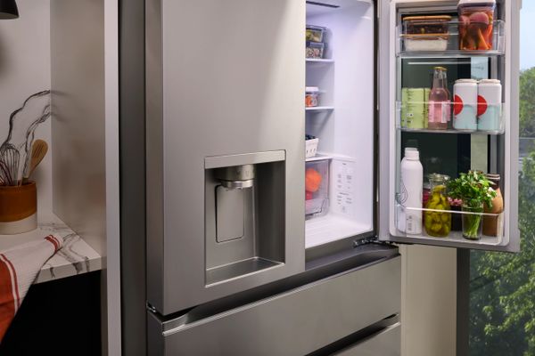 A close-up of the LG LF29S8365S refrigerator with its door open  