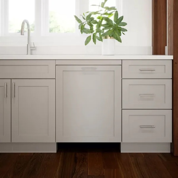 The Bosch 800 Series  SGV78C53UC dishwasher with a custom panel front in a farmhouse kitchen 