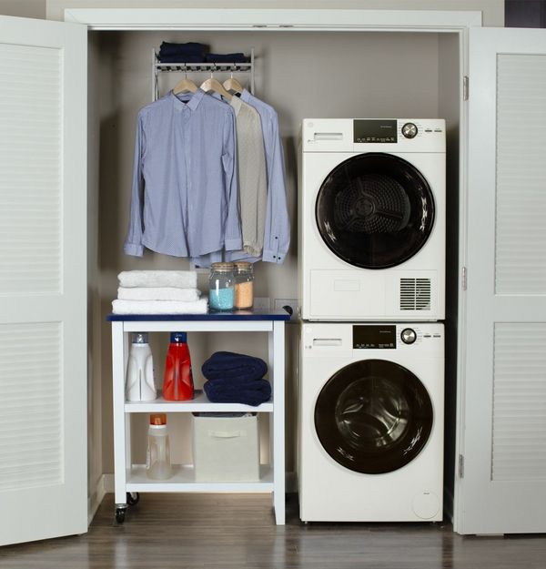The GE GFW148SSMWW washer and GE GFT14ESSMWW dryer featured in a closet