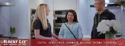 An Albert Lee sales associate helping a man and a woman with a Albert Lee logo and location at the bottom of the graphic 