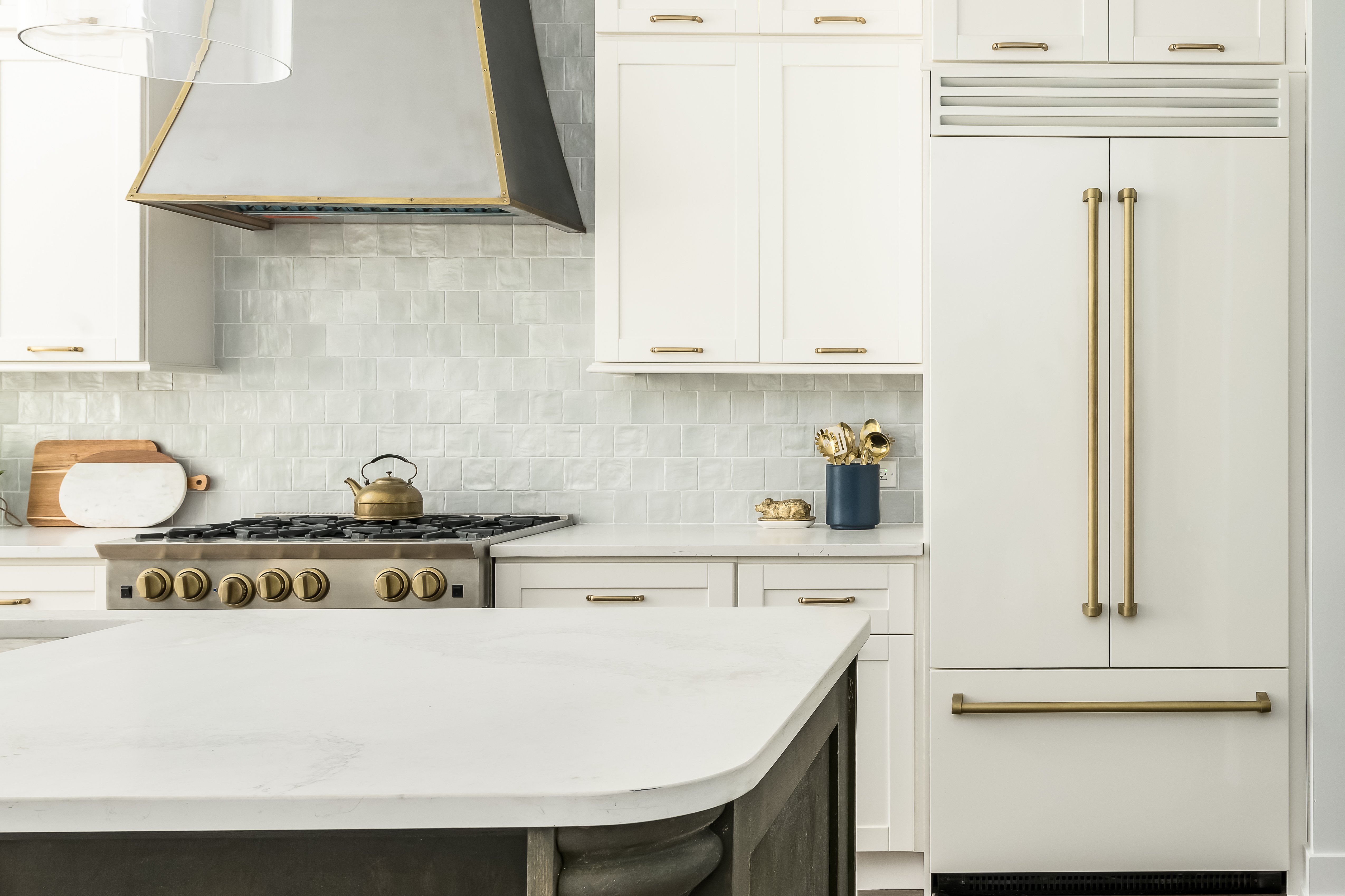 A modern kitchen with white appliances 