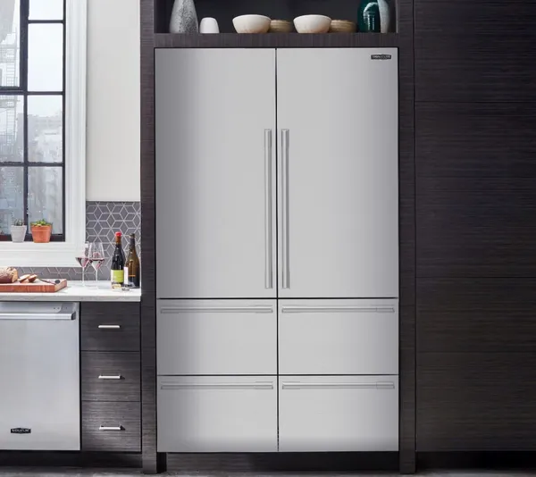 The Signature Kitchen Suite SKSFD4826P refrigerator featured in a kitchen 