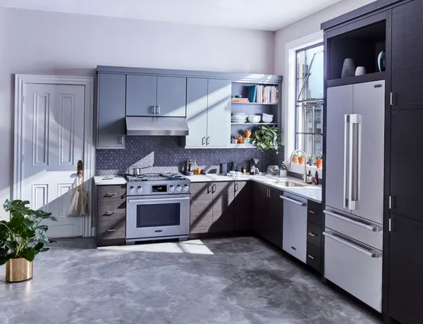 A kitchen featuring Signature Kitchen Suite appliances 