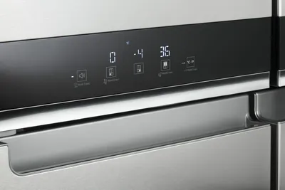 A close-up of the Whirlpool WRQA59CNKZ refrigerator handle 