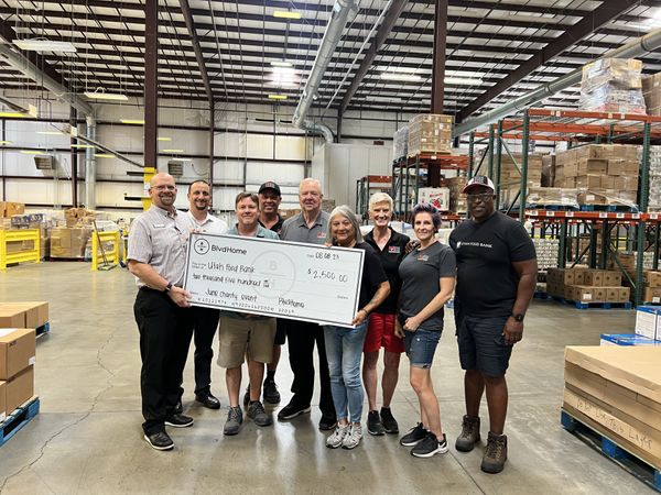 BlvdHome presents a check to the Utah Food Bank
