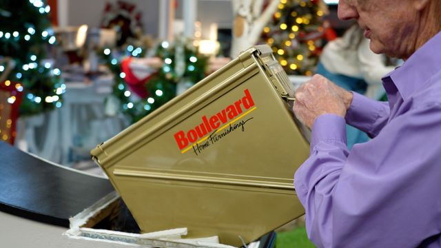 The time capsule is pulled out of its resting place from inside a display wall at Boulevard Home in St. George.  (11/18/2024)