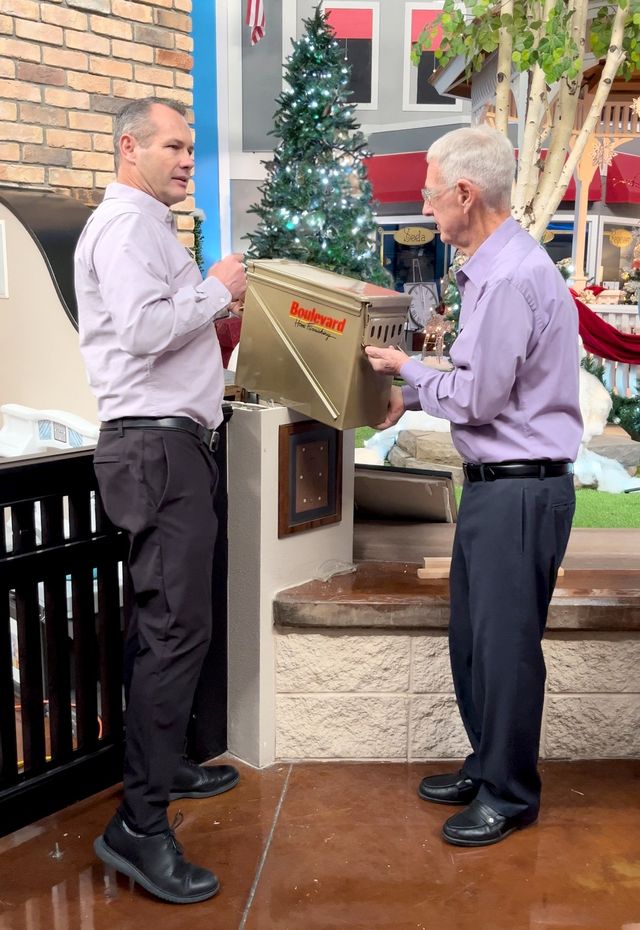 Marc and Tony Wittwer with the time capsule at Boulevard Home’s St. George store.