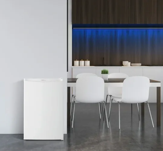 The Danby Designer Series DAR044A4WDD compact fridge featured in a modern space