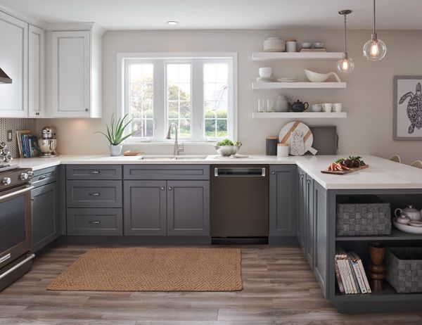 A black stainless steel KitchenAid dishwasher in a kitchen