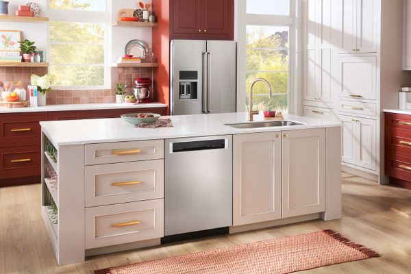 A KitchenAid stainless steel dishwasher in a kitchen island