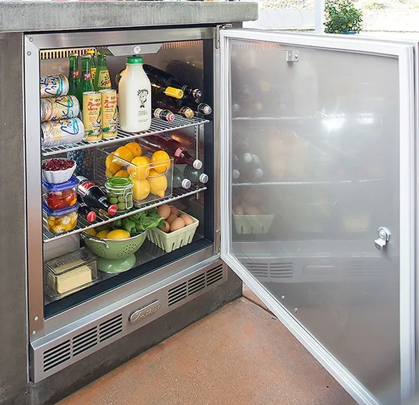 The Alfresco Sedona URS-1XE refrigerator with its door open 