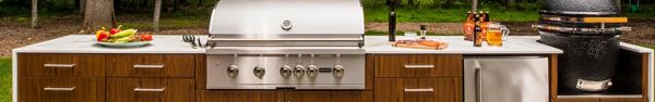 A Coyote built-in grill in a an outdoor kitchen island 