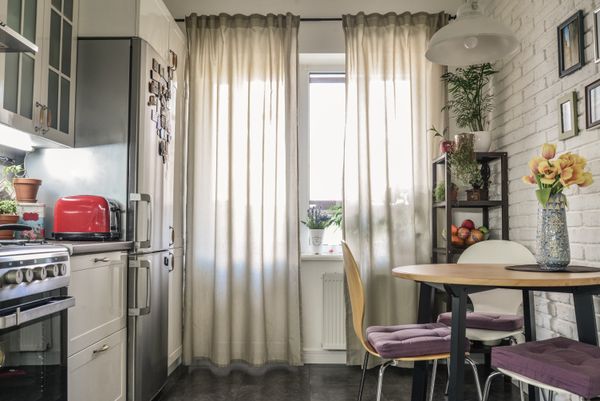 A wide view of a cozy, boho-inspired kitchen 