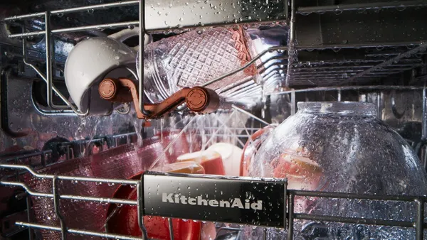 A close-up of the KitchenAid 3rd rack jet system washing dishes 