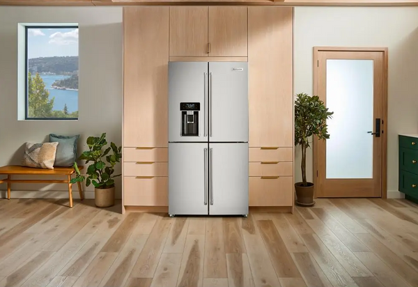 The KitchenAid KRQC736RPS refrigerator featured within wooden cabinets