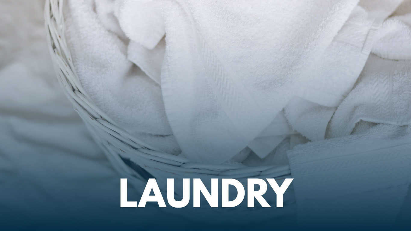 Image of clean laundry in a white laundry basket.