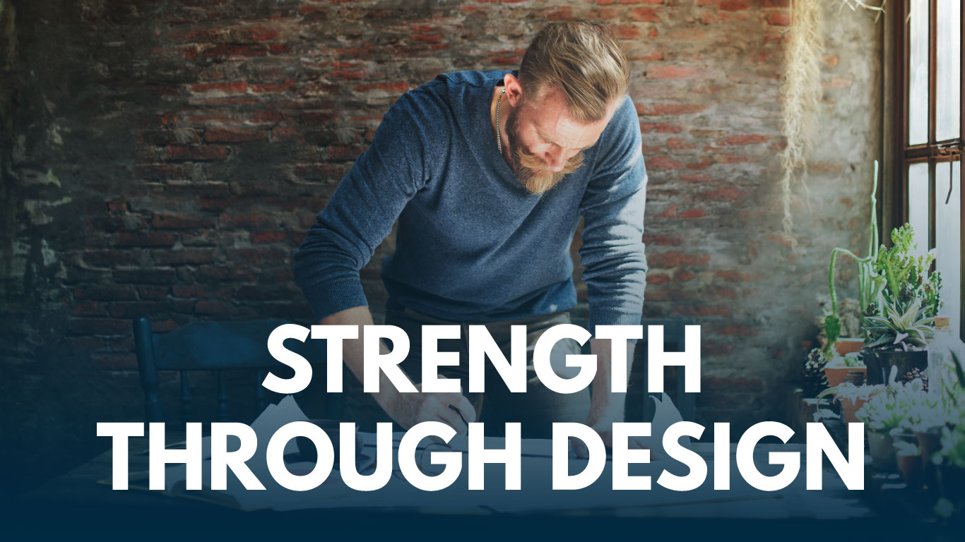 Image of designer working on blueprints in studio.