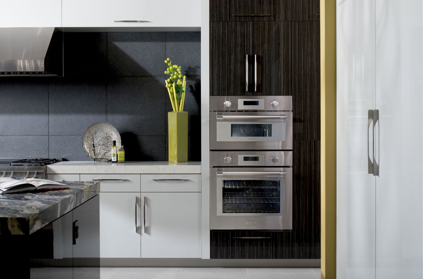 A wide shot of a kitchen featuring a Thermador oven and speed oven 