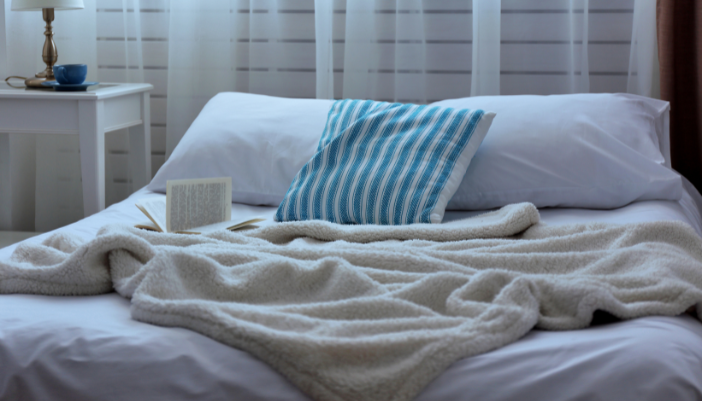 open book on a bed