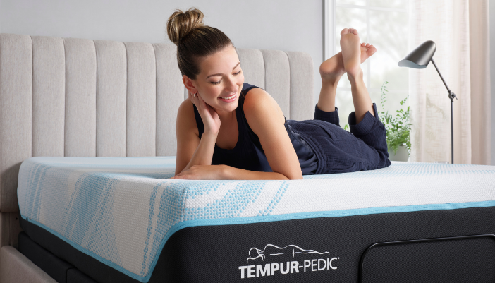 woman enjoying a tempur-breeze mattress