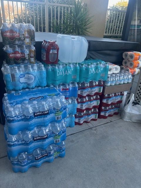 Bottled water donations piled together