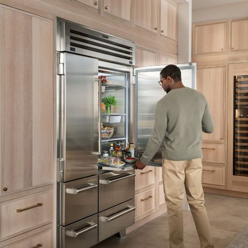 Man Using his SubZero Refrigerator