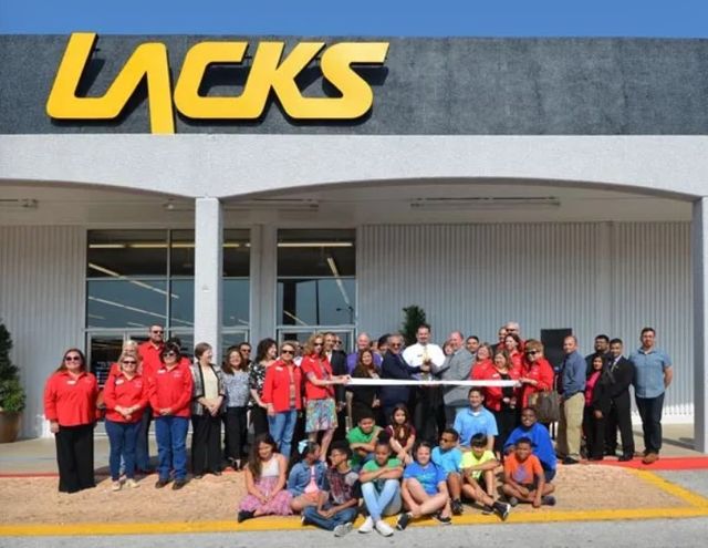 front view of Lacks employees in front of Lacks Furniture store