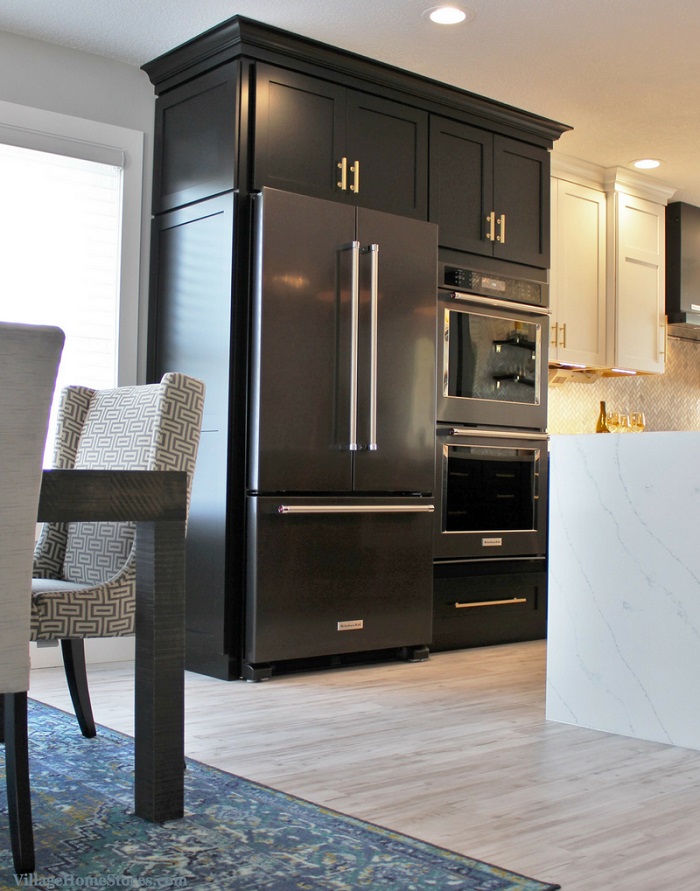 KitchenAid black stainless fridge and wall oven in a kitchen remodel by Village Home Stores