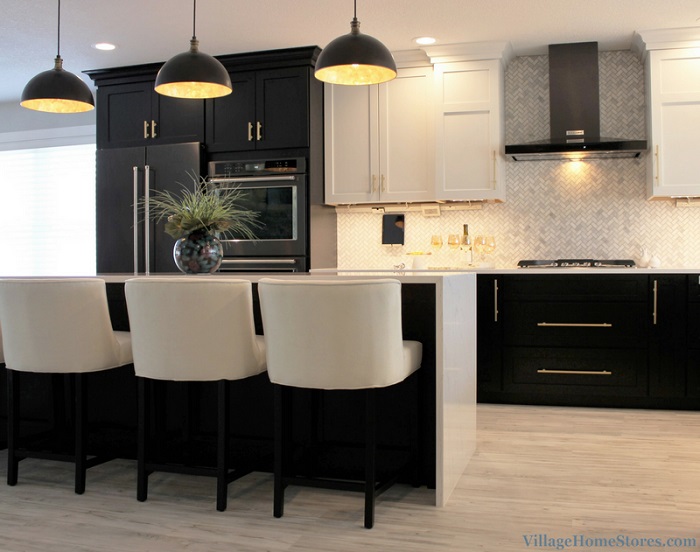 contemporary kitchen design with white and black cabinets, black stainless appliances, and black and gold lighting