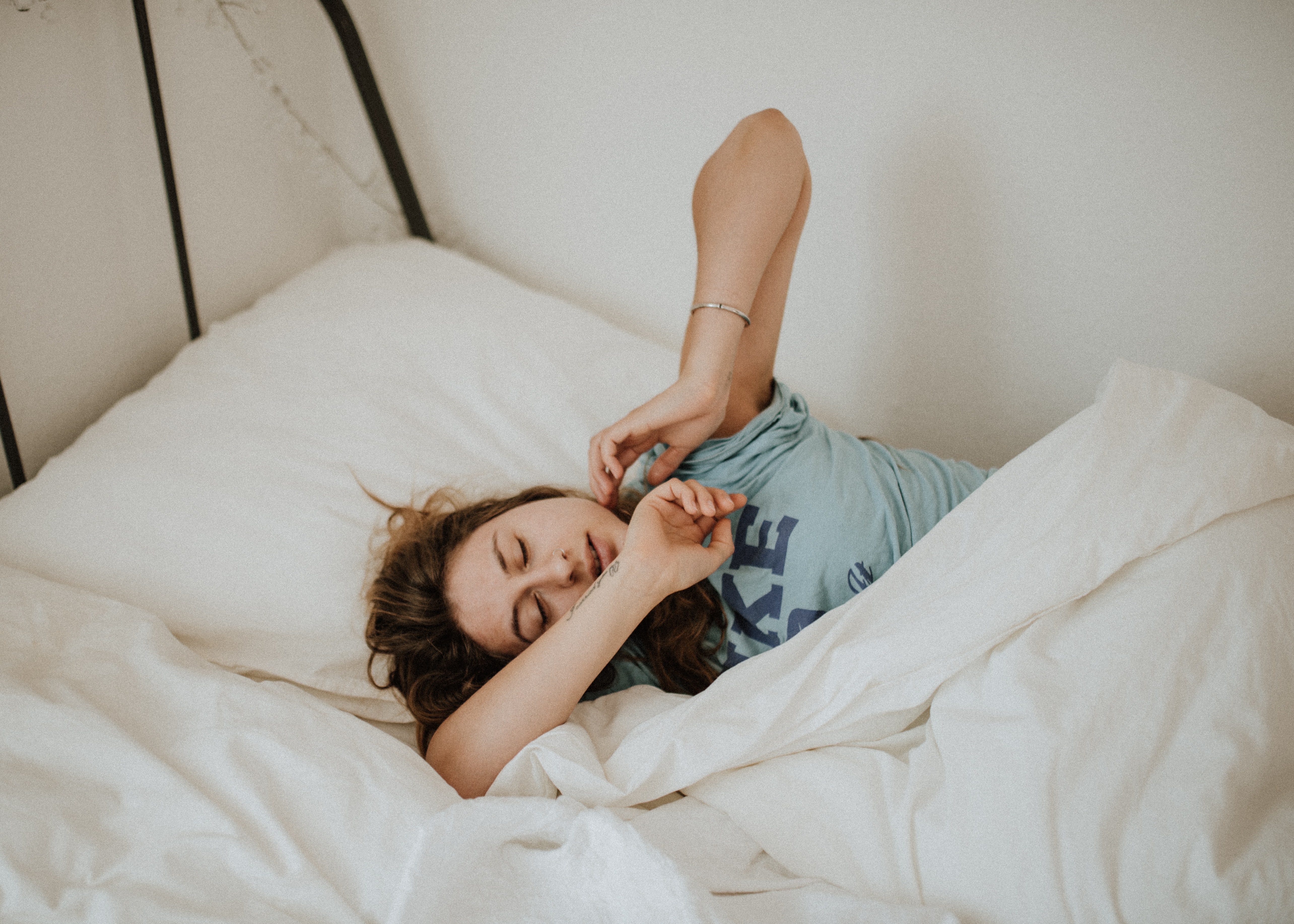 Woman sleeps in a bed