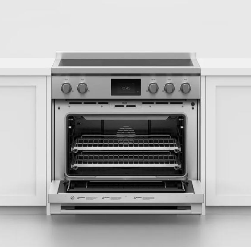 Fisher & Paykel induction range with surrounding white cabinetry 